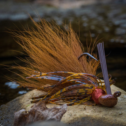 a Bold Craw Hybrid-Skirt Casting Jig on a rock